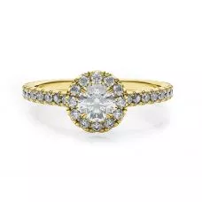 Anillo de oro amarillo de 18 quilates con diamante redondo en halo
